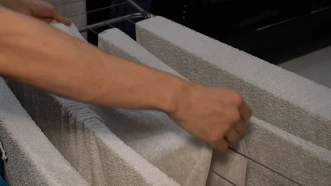 Man hangs towels 库存影片 120091355