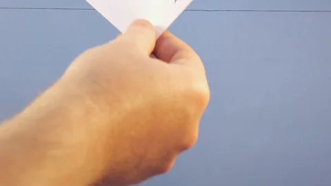 A man hangs a white sheet of paper with a black inscription "cyber monday" on a Stock Footage 124079367