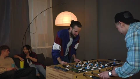 Man Is Happy about Scoring the goal. Boy And Girl  are Drinking Beer Stock Footage 150290742