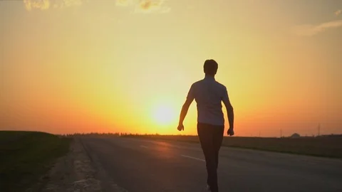 The man is happy at sunset. slow motion Stock Footage 89383878