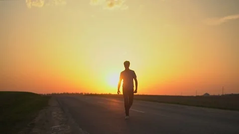 The man is happy at sunset. slow motion Stock Footage 89384118