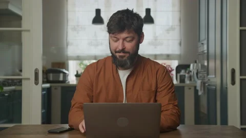 Man happy working a computer laptop indoors Stockbeeldmateriaal 200180093