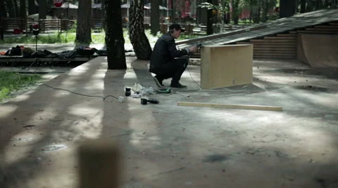 Man hard grinds goods from wood Stock Footage 59241909