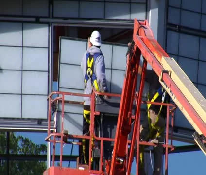 Man in hardhat installs Windows Stock Footage 21564893