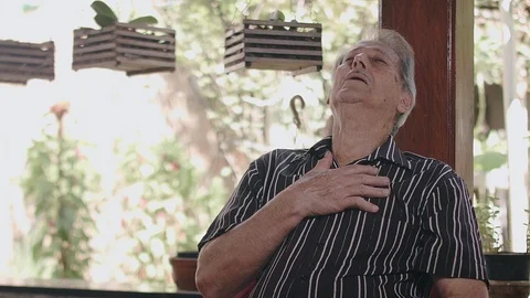 A man has breathing problems because of the covid-19 Stock Footage 126945550