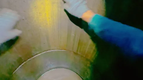 A man has fallen into a well and is trying to get out of it. Stock Footage 319428161