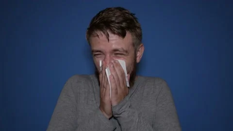 A man has the flu, a virus, or an allergy. Stock Footage 159422089