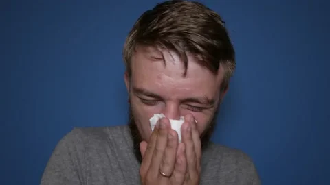 A man has the flu, a virus, or an allergy. Stock Footage 159422443