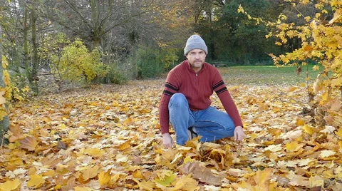 A man has fun in autumn Stock Footage 56592878