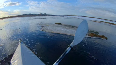 Man has great time kayaking on rowing boat in tranquil river Stock Footage 123411224
