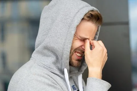 Man has headache. man has headache outdoor. man has headache in the street. Stock Photos