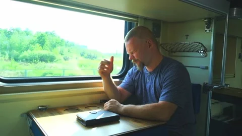 Man has a headache on the train Stock Footage 156019123