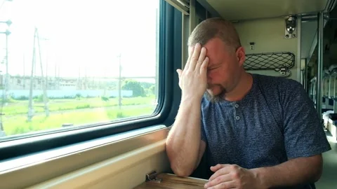 Man has a headache on the train Stock Footage 156891524