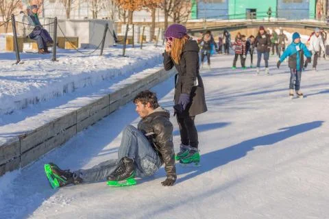 A man has hurt himself while ice skating Stock Photos