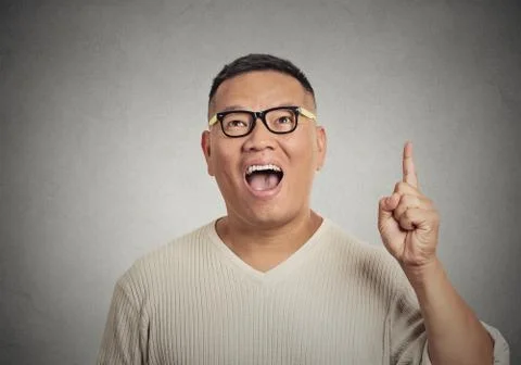 Man has an idea, pointing with finger up Stock Photos