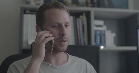 Man has negative conversation on phone Stock Footage 78037444