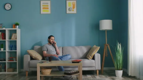 Man Has a Phone Conversation Stock Footage 132432709