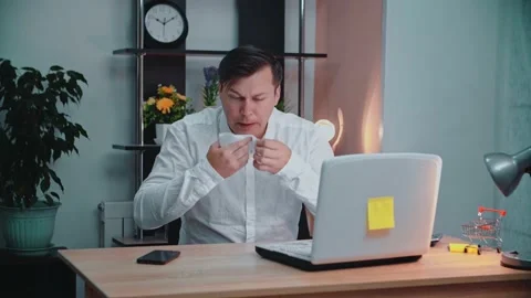The man has a runny nose at the table. Stock Footage 145365402