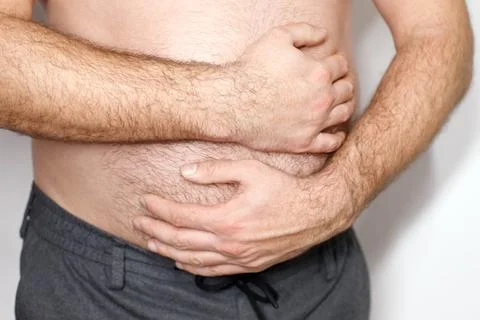 The man has a stomach ache. problems with the stomach, intestines Foto stock