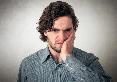 Man has a tooth ache Stock Photos