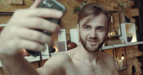 A man has a video-chat call with his girlfriend Stock Footage 134679990