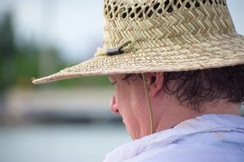 Man with hat on beach Stock Photos