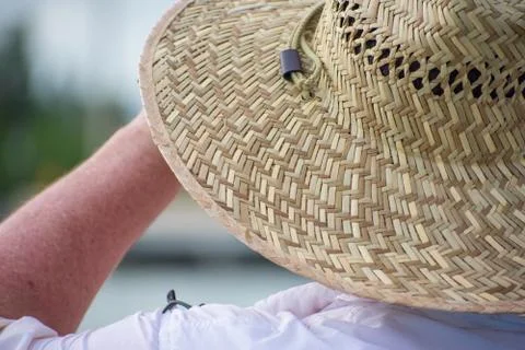 Man with hat on beach Stock Photos