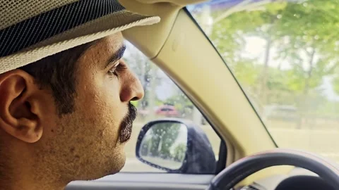 Man in a hat driving a car. Stock Footage 284669689