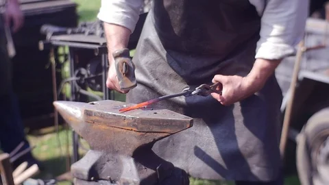 Man in a Hat is Engaged in Blacksmithing Stock Footage 74511377