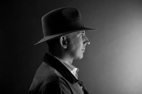 Man in a hat looking at the light Stock Photos