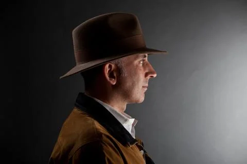Man in a hat looking at the light Stock Photos