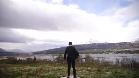 A man in a hat stands on the street Stock Footage 137227066
