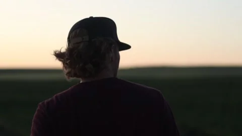Man with Hat Walking in Sunset Video stock 269994611