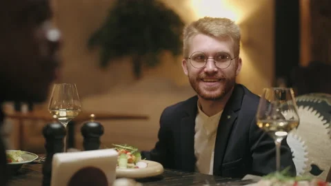 Man have fun in restaurant, dining with friends or family, portrait of handsome Stock Footage 227938355