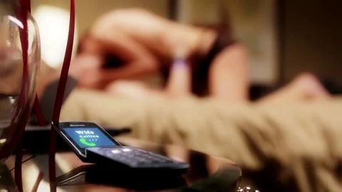 Man having an affair while his wife is calling Stock-Footage 70344652