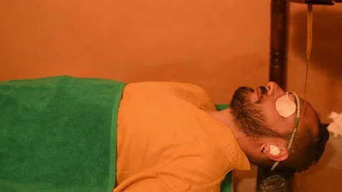 Man having Ayurveda healing therapy for head relaxation massage Stock Footage 174067796