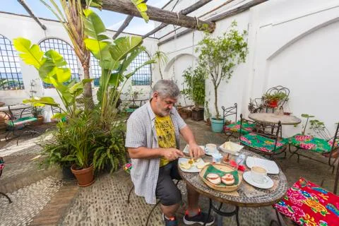 Man having breakfast in the backyard Stock Photos