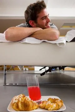Man having breakfast in bed Stock Photos