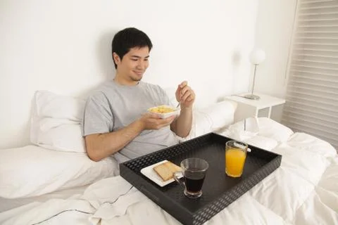 Man having a breakfast Stock Photos