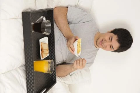 Man having a breakfast Stock Photos