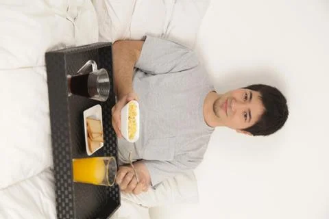 Man having a breakfast Stock Photos