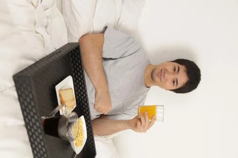 Man having a breakfast Фото