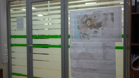 A man, having come to work first, opened his office with a key Stock Footage 111180160