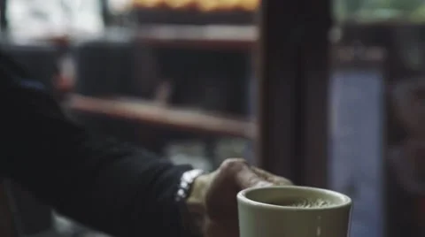 Man having cup of coffee in cafe Stock Footage 63464631