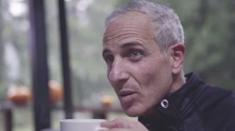 Man having cup of coffee in cafe Stock Footage 63464701