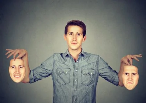 Man having different masks for different moods Stock Photos