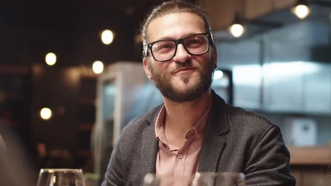 Man having dinner with friends in restaurant. Stock Footage 125084986