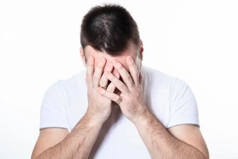 A man having a disturbing problem over white Stock Photos