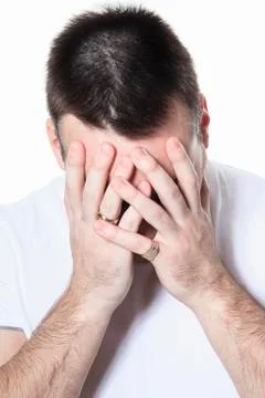 A man having a disturbing problem over white Stock Photos