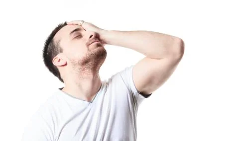 A man having a disturbing problem over white Stock Photos